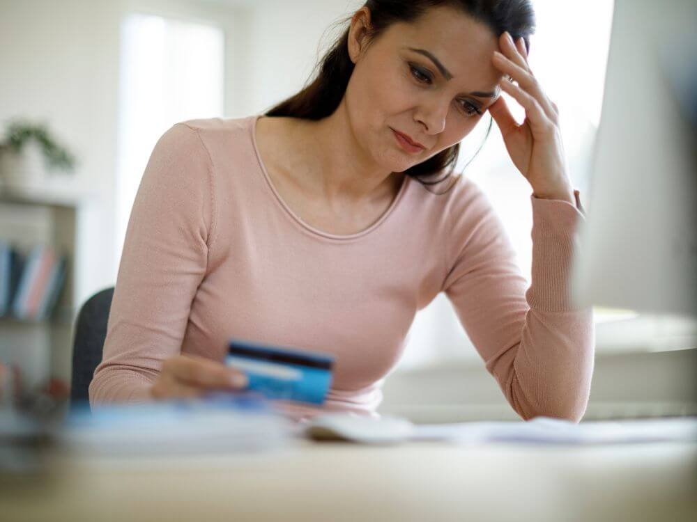 Online payday loan sad woman in debt